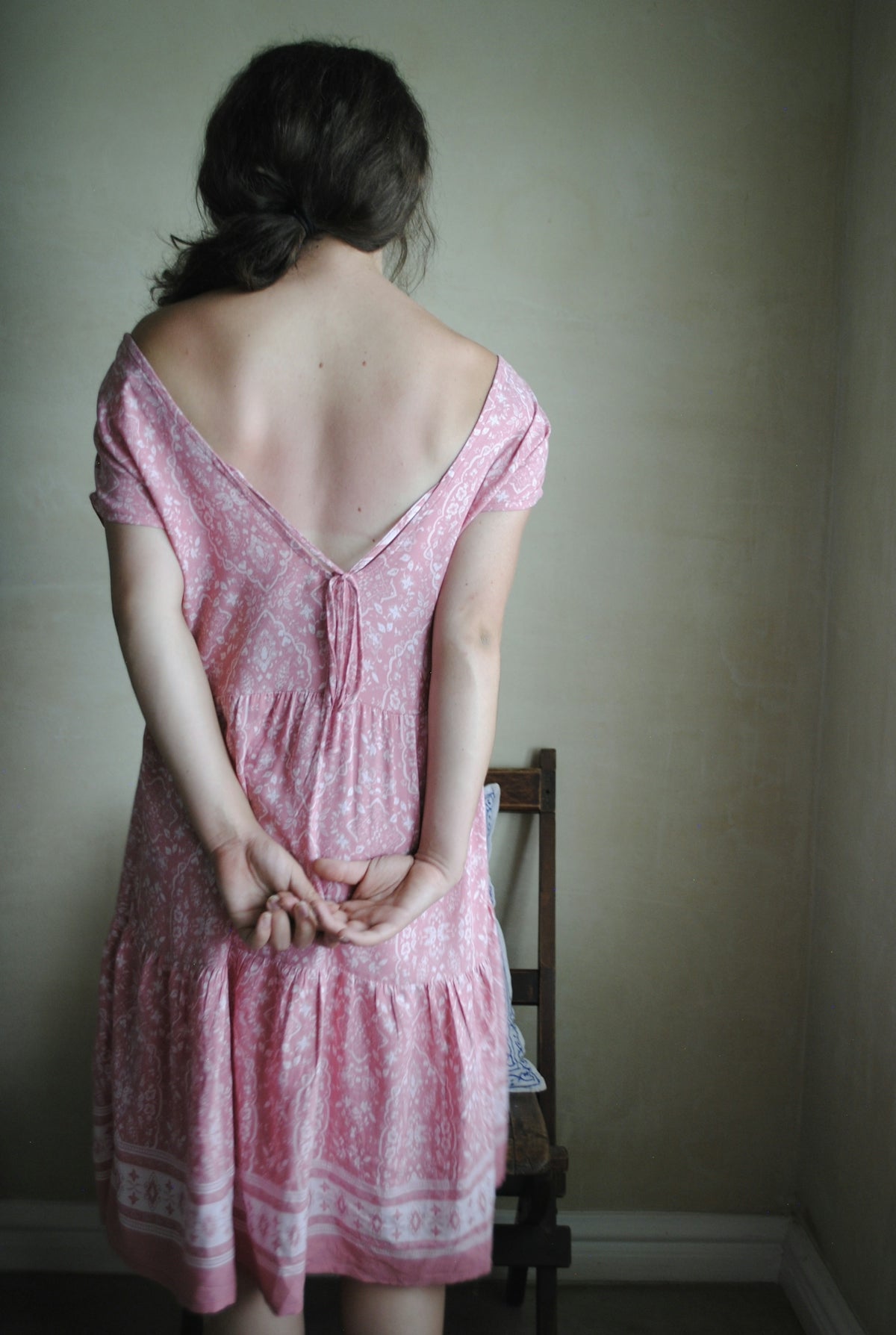 woman in pink sleeveless dress