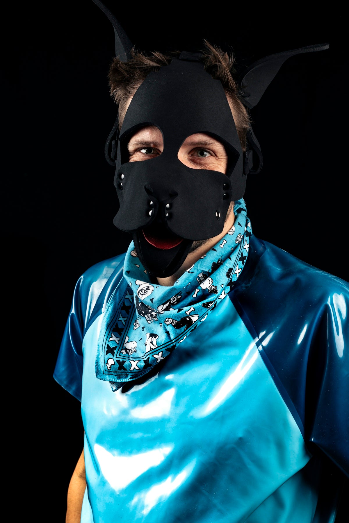 Man wearing a black puppy mask and blue shirt